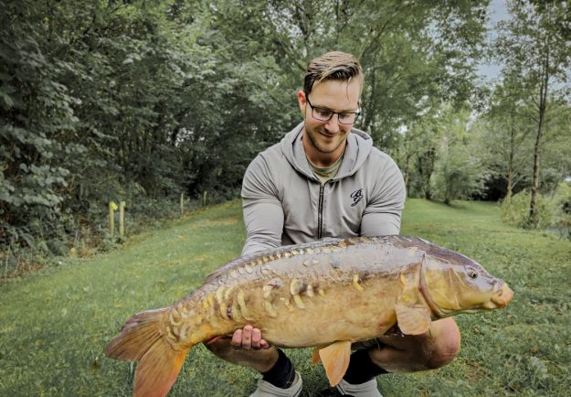 Jordan with a 21lb mirror carp!